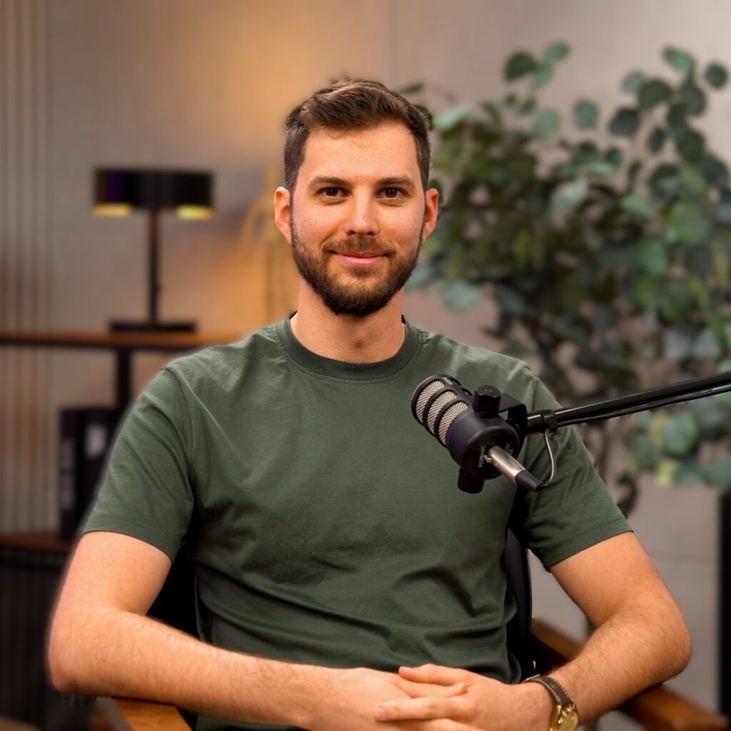 photo of alex shevchenko in a podcast studio, the founder of online presence optimization